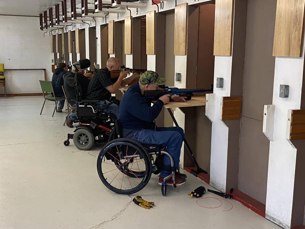 Air gun competition participants