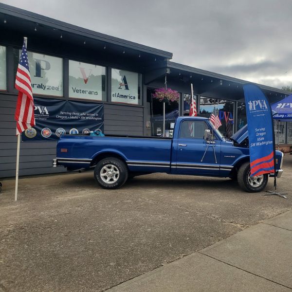 Veterans in wheelchairs shaking hands