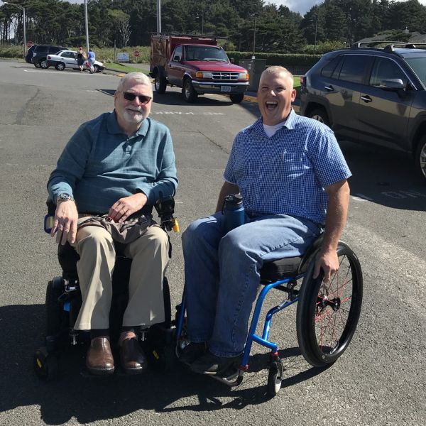 Veterans in wheelchairs shaking hands